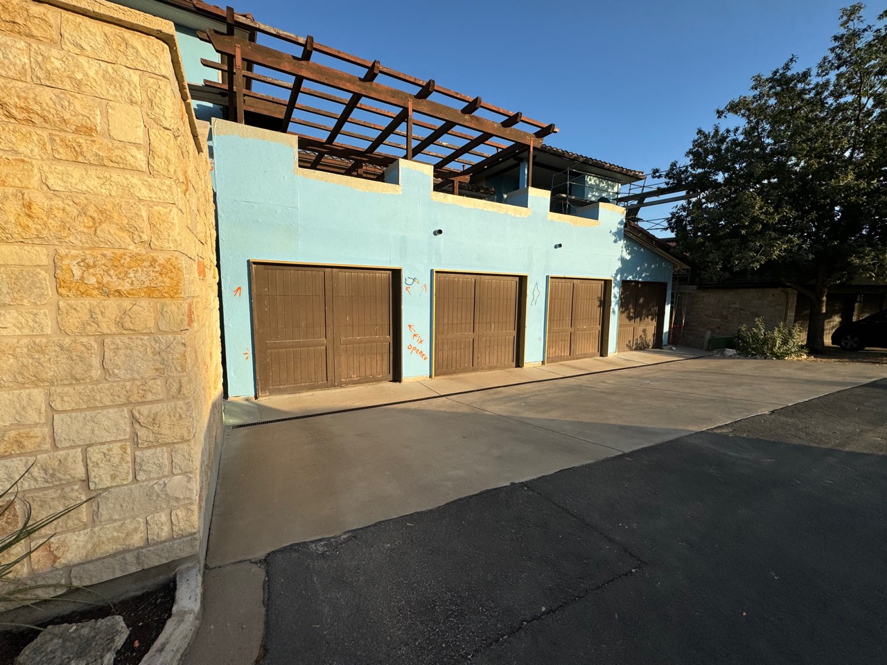 Garage exterior covered with blue waterproofing membrane